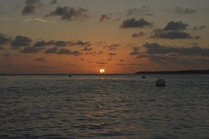 a sunset over a body of water