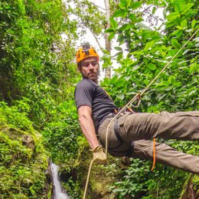 Man climbing a cliff in Puerto Rico