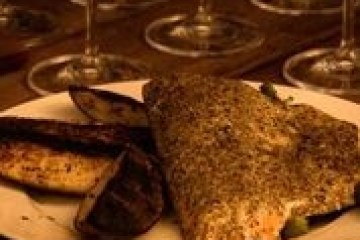 a plate of food and glasses of wine