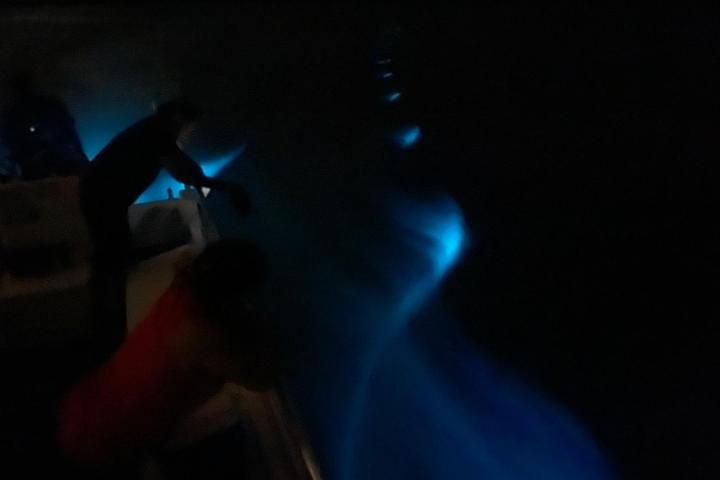 a man sitting in a dark room