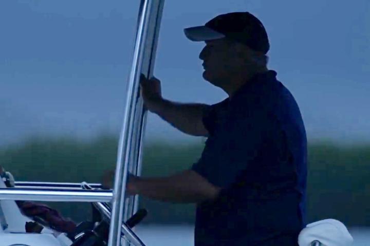 a man standing in front of a car